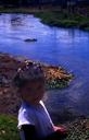 Child by the water.